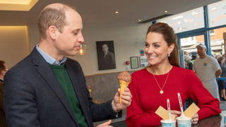 Prince William samples an ice cream standing next to Kate Middleton