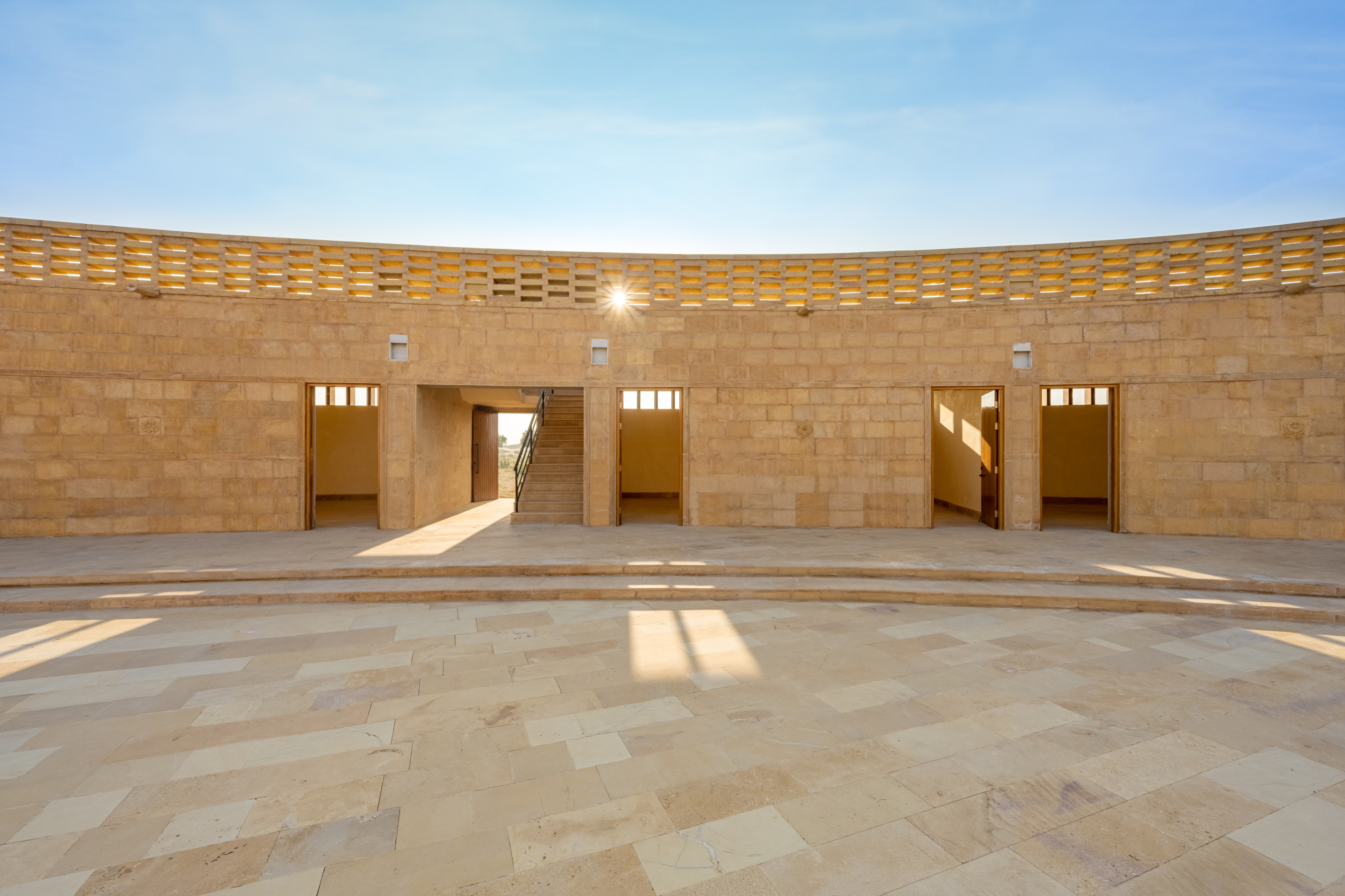 the empty courtyard of the of the sustainable girl's school in India by Diana Kellogg in a shot that shows off its intricate brickwork
