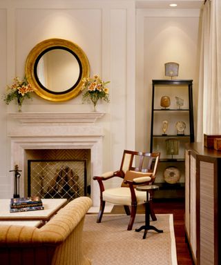 traditional living room with cream walls and fireplace, wooden furniture