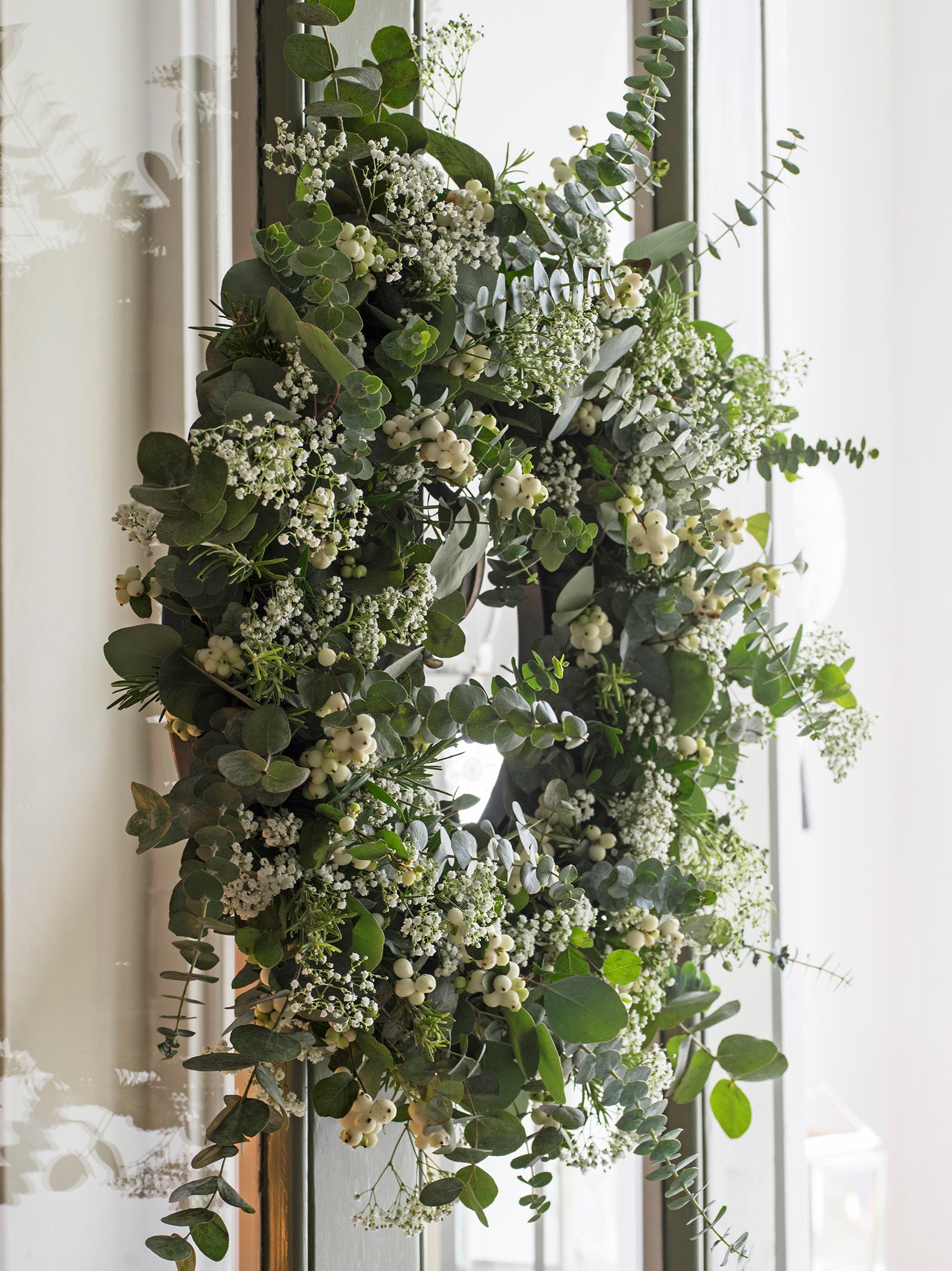 Closeup of natural winter wreath with eucalyptus and white berries