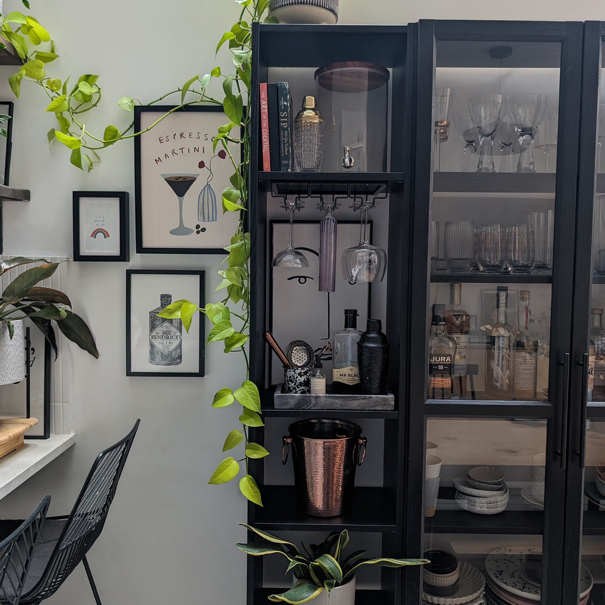 storage for glassware next to a kitchen