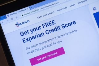 Experian website on a laptop computer, offering free credit scoe information