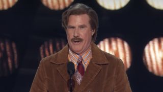 Will Ferrell dressed as Ron Burgundy telling jokes at The Roast of Tom Brady