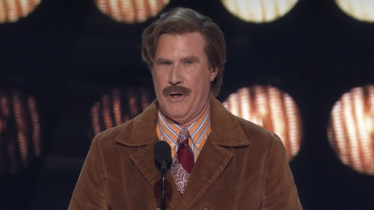 Will Ferrell dressed as Ron Burgundy telling jokes at The Roast of Tom Brady