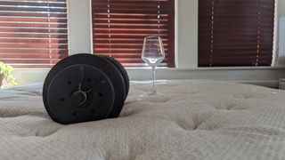 Testing motion isolation with weight and wine glass for Helix Dusk Luxe