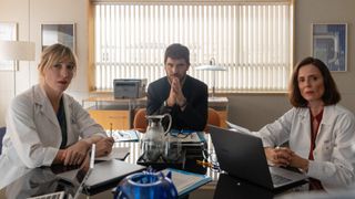 Lluis, Neus, and Pilar sit round a meeting table to speak with Rodri in Breathless