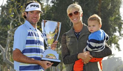 Watson holds a trophy