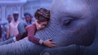 Peter hugs an elephant in The Magician&#039;s Elephant