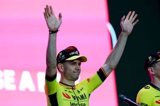 Team Visma-Lease a Bike's Belgian rider Wout Van Aert waves on stage during the opening ceremony and team presentation in Tirana, on May 7, 2025, two days before the departure of the Giro d'Italia 2025 cycling race. The Giro d'Italia 2025 cycling race will depart from Durres, Albania on May 9, and finish in Rome on June 1. (Photo by Luca Bettini / AFP)