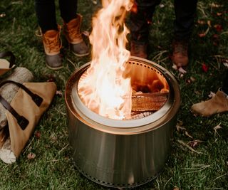 Solo Stove with logs in a carrier