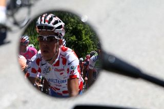 Bernhard Kohl in the mirror showing off his dots.