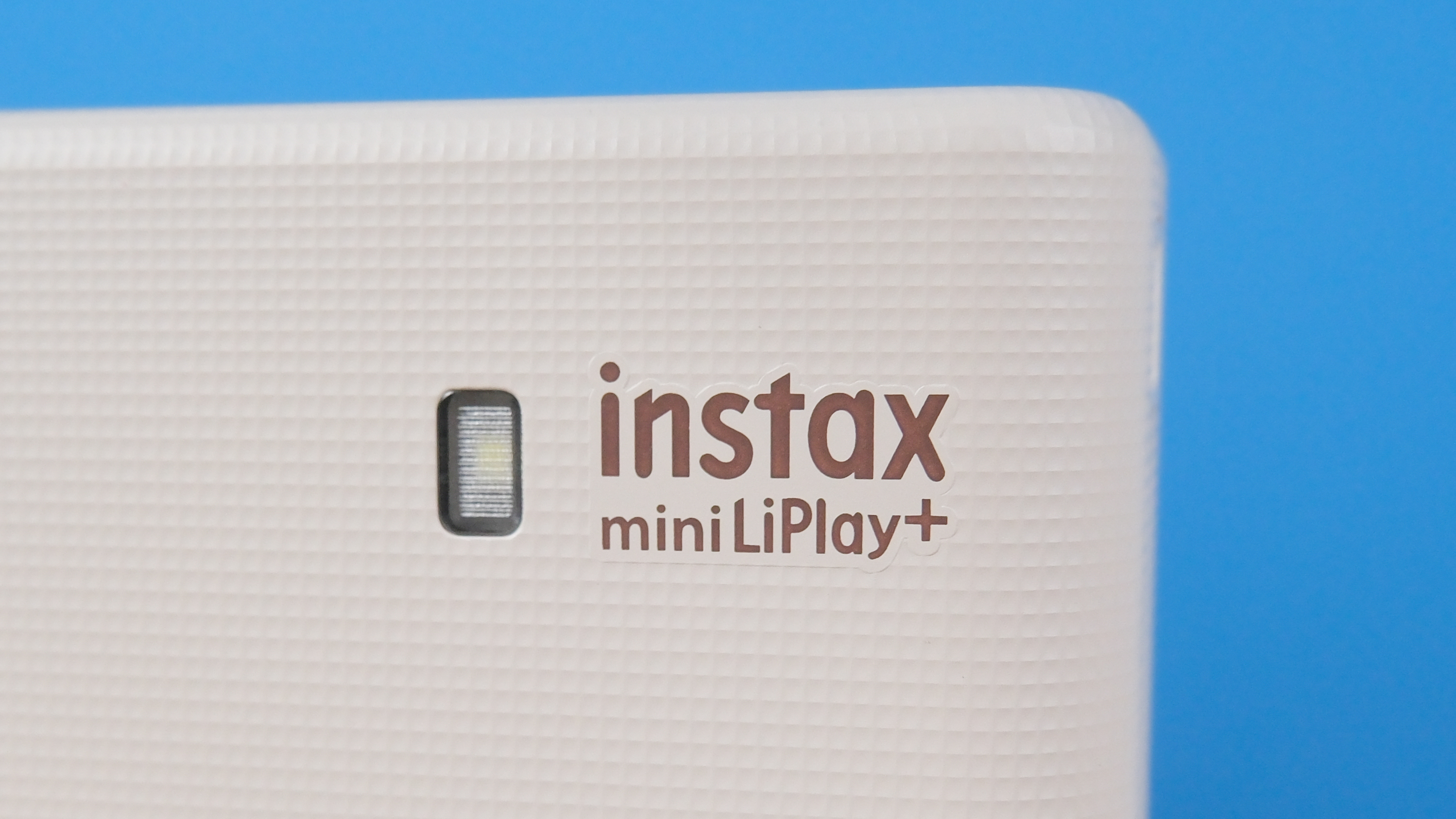 A Sand Beige Fujifilm Instax mini LiPlay Plus hybrid instant camera