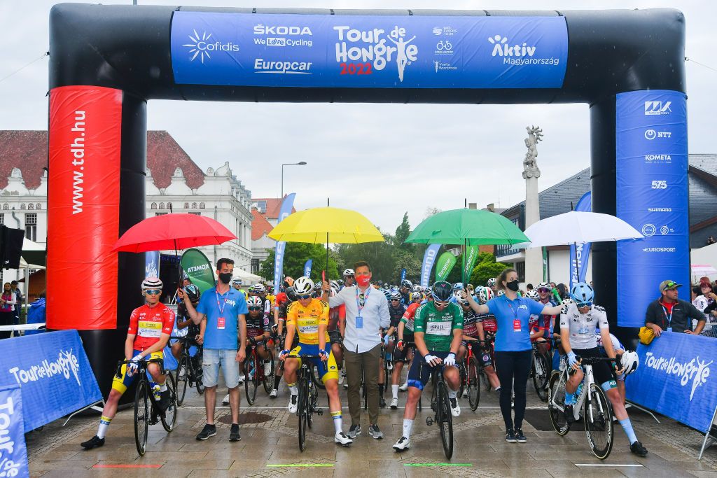 NYIREGYHAZA HUNGARY MAY 13 LR Aaron Van Poucke of Belgium and Team Sport Vlaanderen Baloise Red Mountain Jersey Jens Reynders of Belgium and Team Sport Vlaanderen Baloise Yellow Leader Jersey Rudy Barbier of France and Team Israel Premier Tech Green Points Jersey and Marton Dina of Hungary and EoloKometa Cycling Team White Best Young Rider Jersey prior to the 43rd Tour de Hongrie 2022 Stage 3 a 154km stage from Sarospatak to Nyiregyhaza tourdehongrie on May 13 2022 in Nyiregyhaza Hungary Photo by Dario BelingheriGetty Images