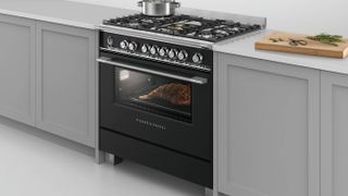 black freestanding cooker with single oven and gas hob