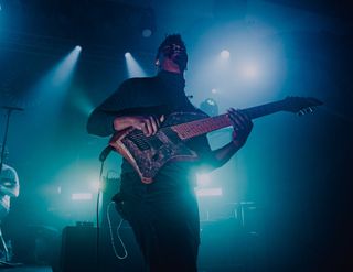 Tosin Abasi performs with the eight-string guitar he designed from the ground up.