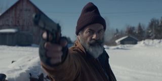 Fatman Mel Gibson aims a gun as Santa Claus