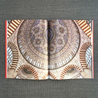Coloured image of mosque interior patterns on pages of book
