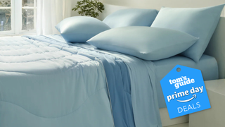 A bed made up with the Rest Evercool sheet set in blue