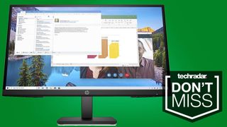 a large monitor against a green background