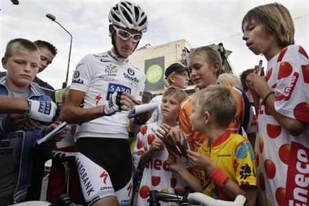 Andy Schleck signs autographs before the race in Boxmeer.