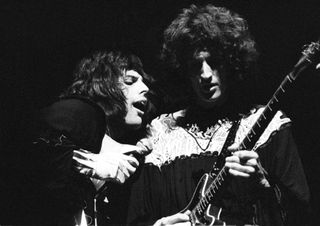 Freddie Mercury and Brian May of Queen performing live on stage (