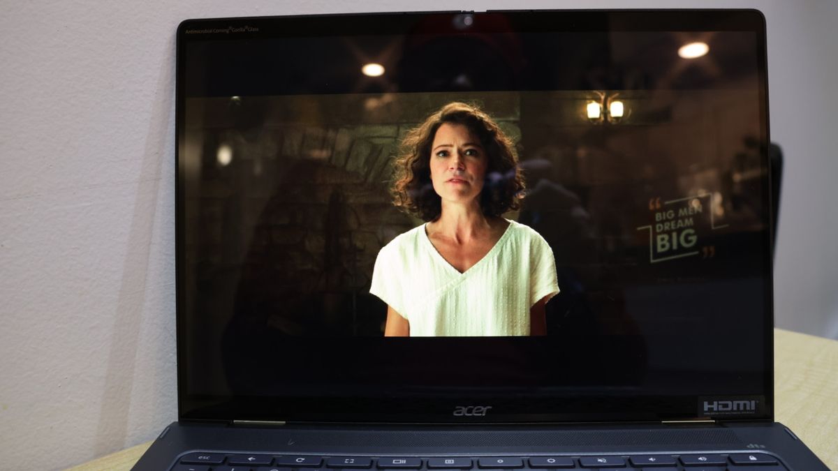 Acer Chromebook Spin 714 showing a movie trailer on the display, against a white background.