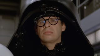 Dark Helmet (Rick Moranis) watches footage on his monitor in Spaceballs.