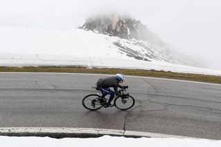 CORTINA DAMPEZZO ITALY MAY 24 Remco Evenepoel of Belgium and Team Deceuninck QuickStep passing through Passo Giau 2233m landscape during the 104th Giro dItalia 2021 Stage 16 a 153km stage shortened due to bad weather conditions from Sacile to Cortina dAmpezzo 1210m girodiitalia Giro on May 24 2021 in Cortina dAmpezzo Italy Photo by Tim de WaeleGetty Images