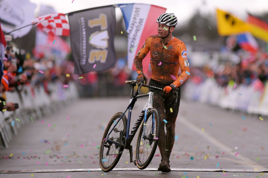 Van der Poel dismounts for the celebration
