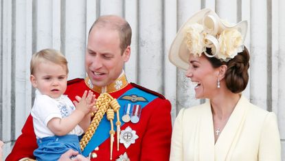 Prince William, Duke of Cambridge, Catherine, Duchess of Cambridge and Prince Louis of Cambridge stand on the balcony of Buckingham Palace during Trooping The Colour,