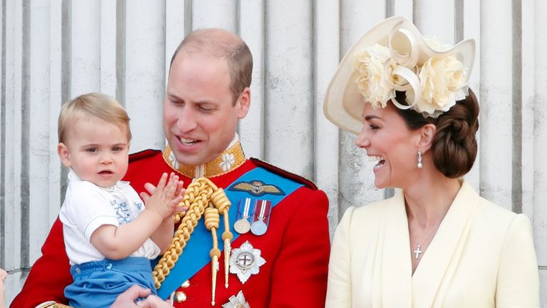 Prince William, Duke of Cambridge, Catherine, Duchess of Cambridge and Prince Louis of Cambridge stand on the balcony of Buckingham Palace during Trooping The Colour,