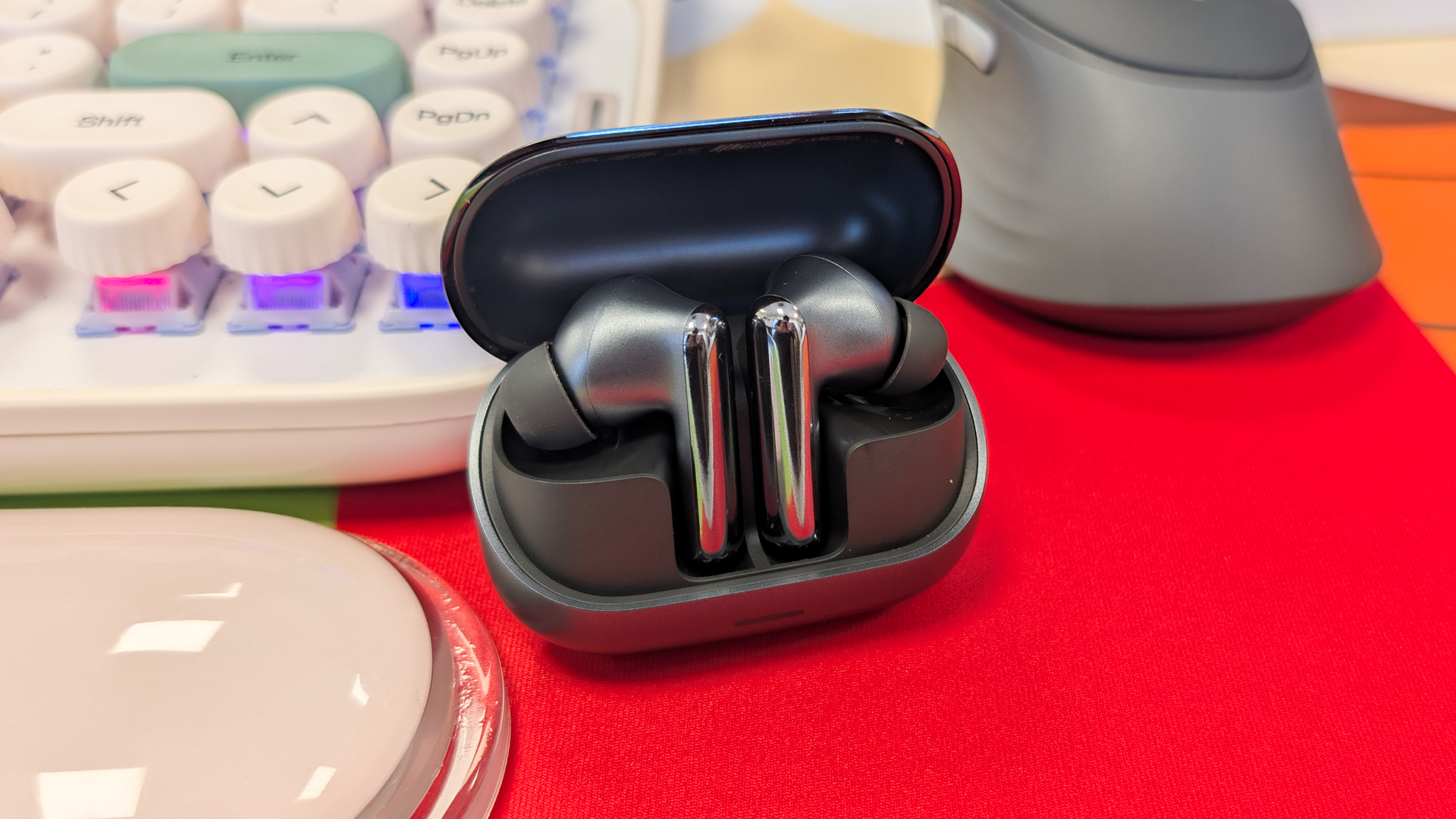 A pair of black Honor Earbuds 4 wireless earbuds