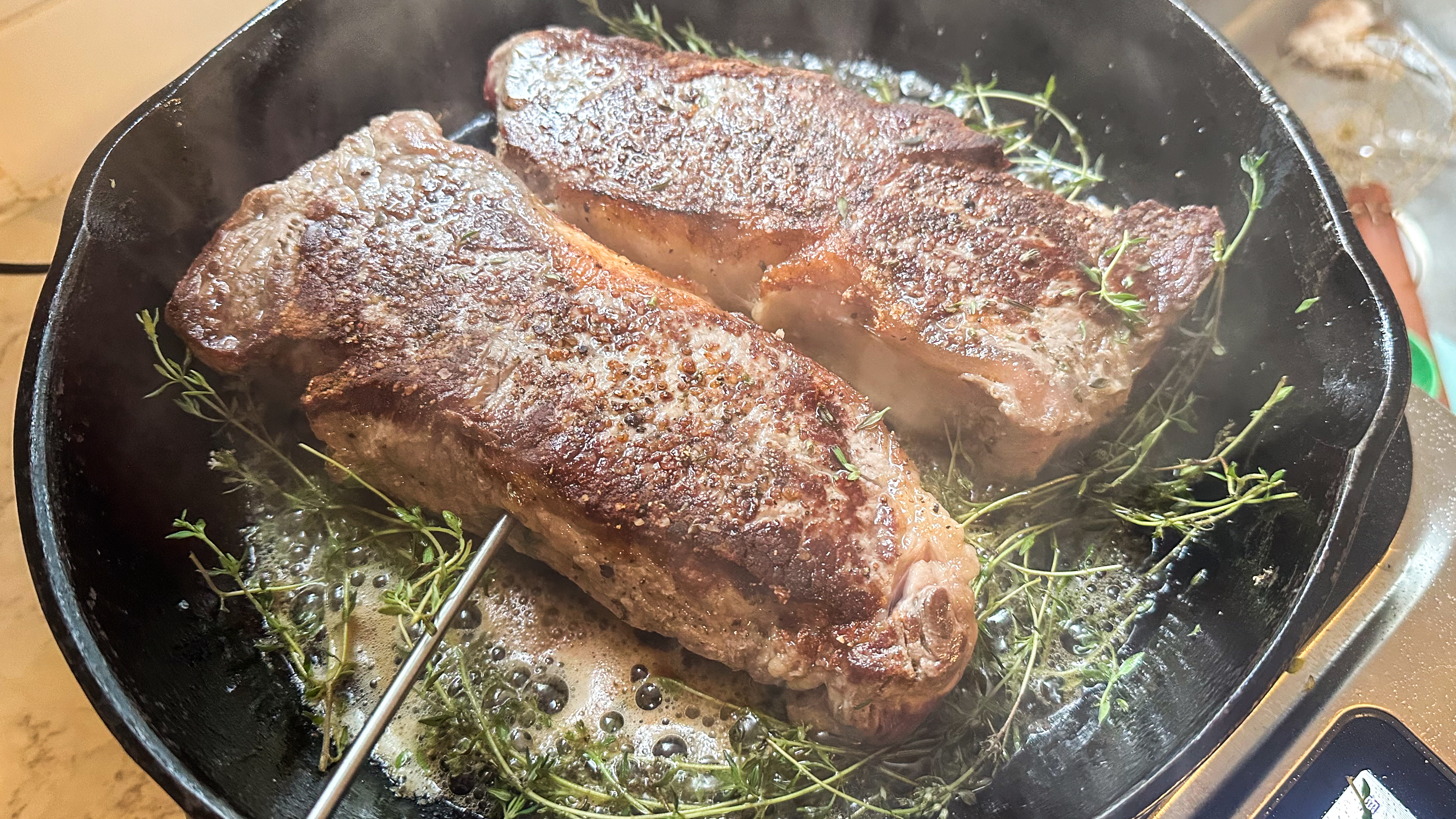 steaks being prepared on the Breville Control Freak induction cooktop