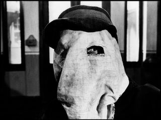 a man with a sack over his face in the movie the elephant man