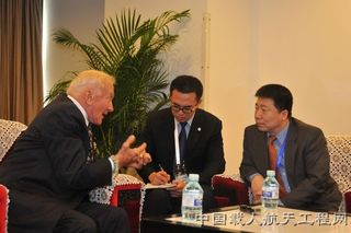 Buzz Aldrin (left) has previously met with China’s first astronaut, Yang Liwei (right). Aldrin will be attending the Association of Space Explorers gathering in Beijing, China on September 9-15 and plans to discuss future space partnerships with China.