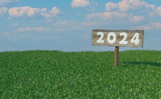 rendering of a sign in the grass that has the year 2024 written on it