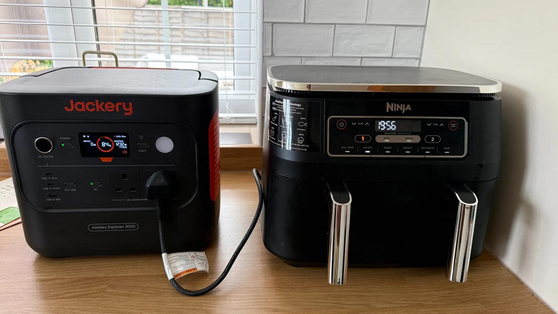 A Jackery 2000 V2 powering a Ninja air fryer in the kitchen