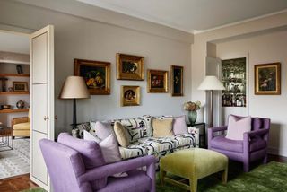 A green sofa with purple accents