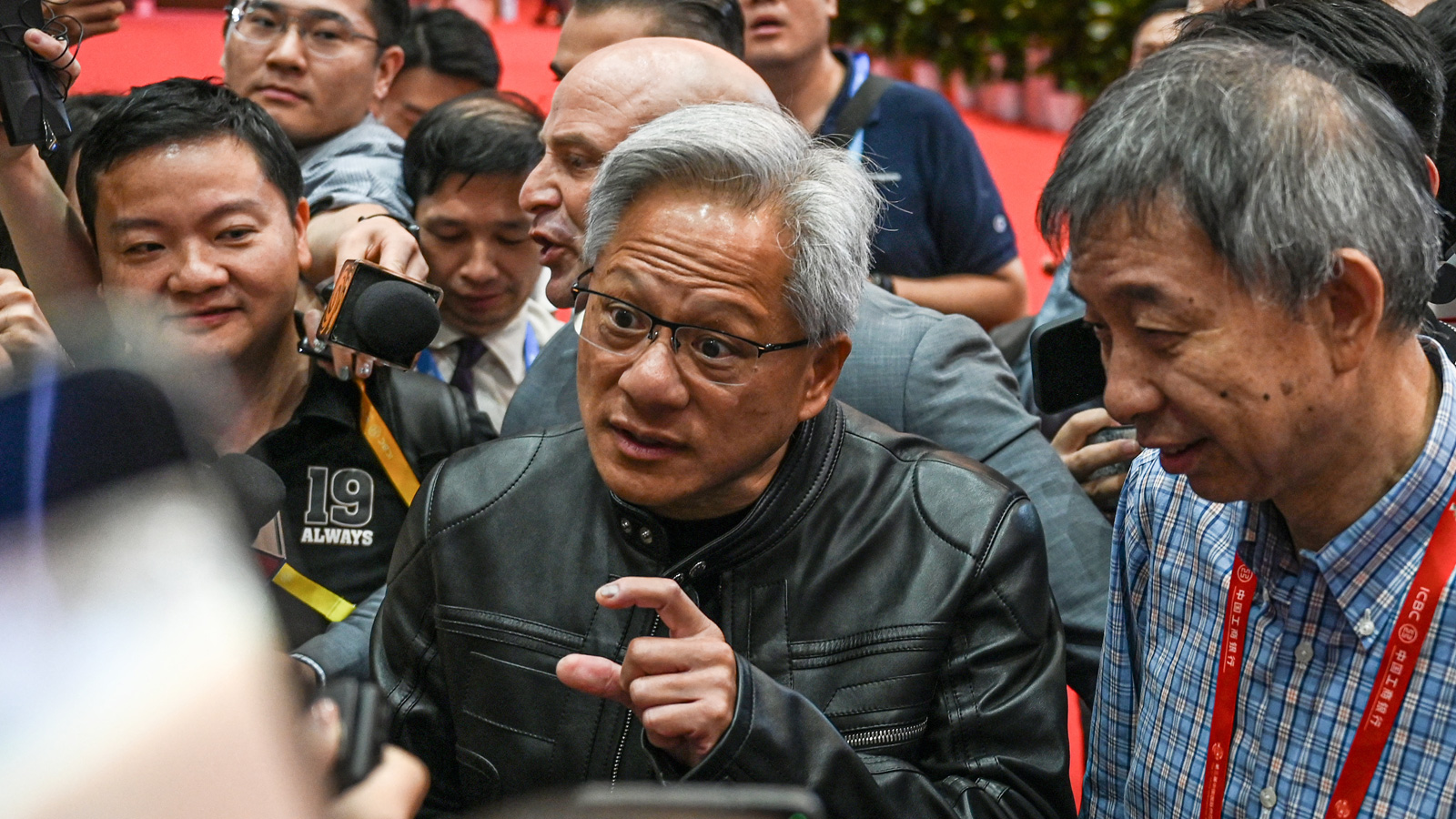 Jensen Huang explaining the size of something to the press.