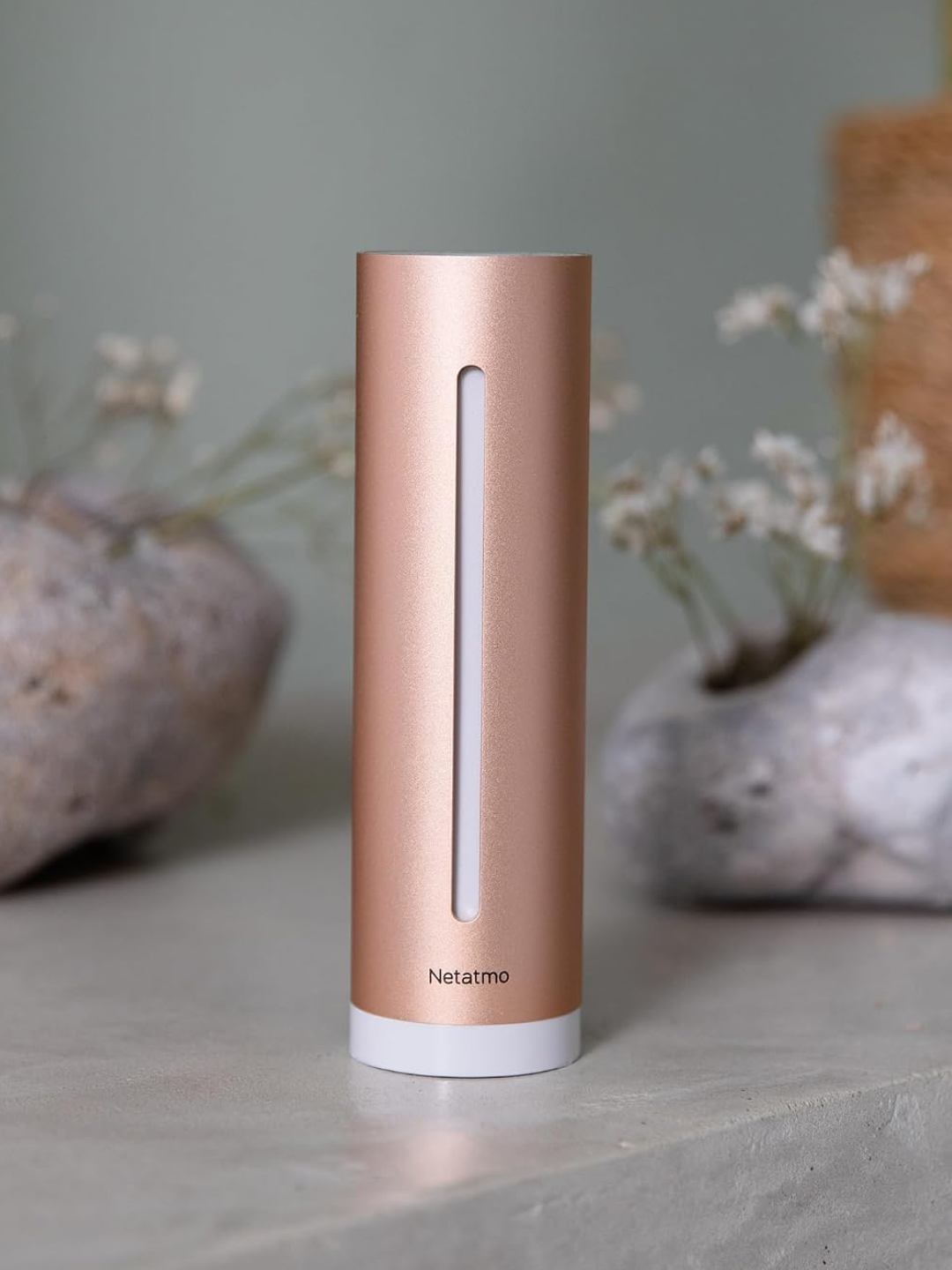 A rose gold air quality monitor from Netatmo
