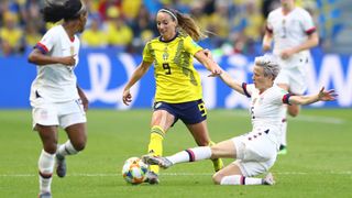 Megan Rapinoe and Crystal Dunn of the U.S. Women's Soccer Team (Credit: Martin Rose/Getty)