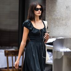 Kaia Gerber wears black Doen Quinn Dress