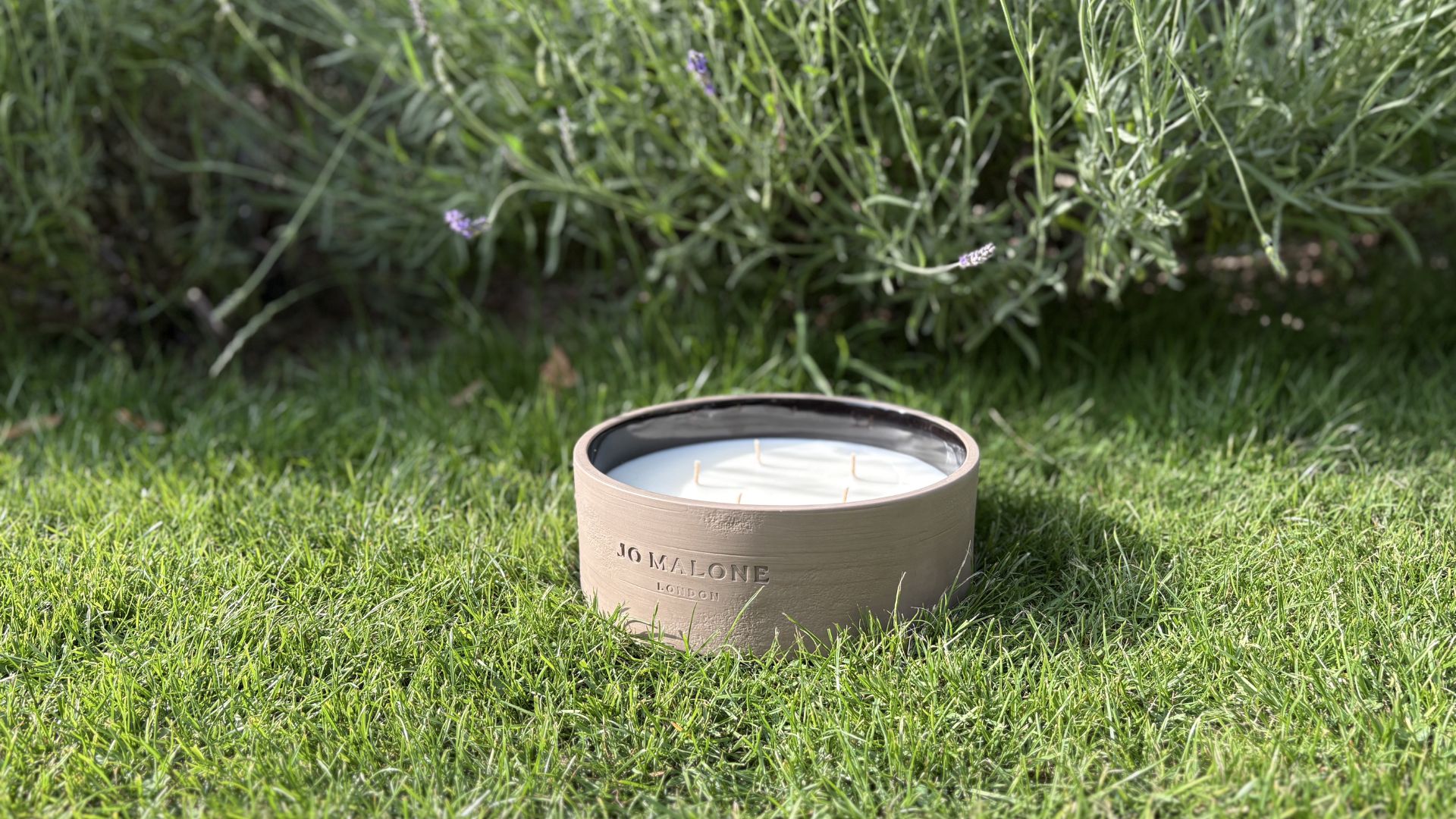 Jo Malone Outdoor Candle on grass outside