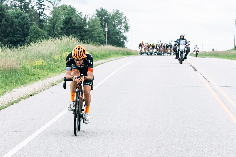 Ryan Anderson (Optum Pro Cycling) launches a solo attack in the hopes of dislodging yellow jersey holder Ben Hill (Donkey Label)