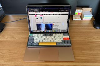 Nuphy Air60 keyboard sat on top of MacBook Air keyboard