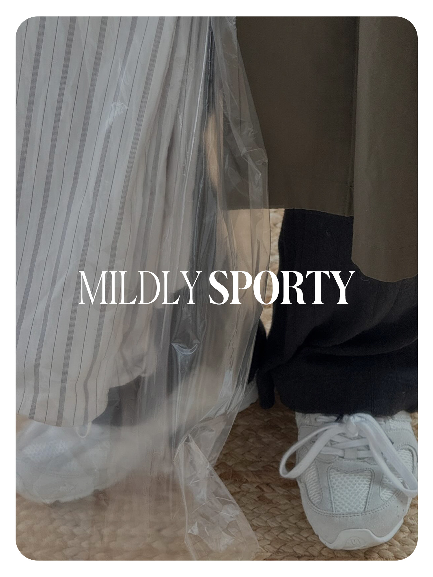 Monikh Dale&#039;s white minimalist sporty sneakers worn with black pants and a long trench coat. Text reads, &amp;quot;Mildly Sporty.&amp;quot;