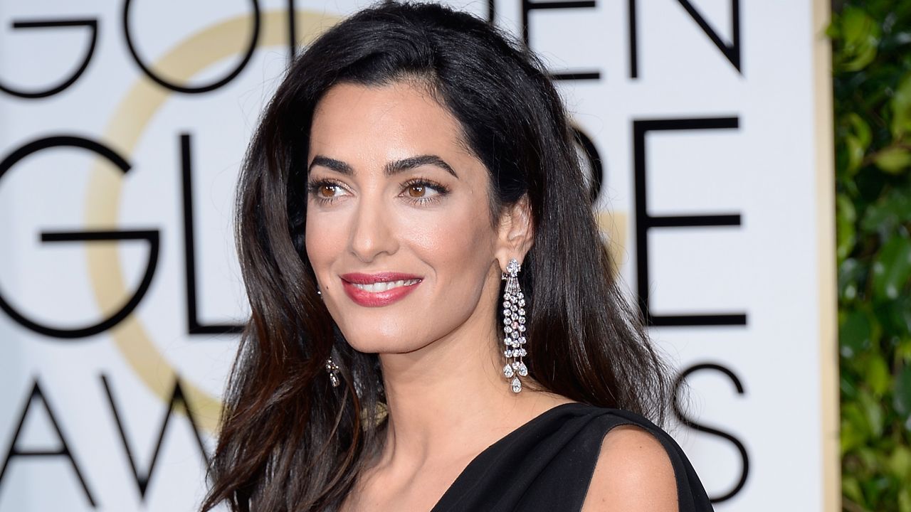 Amal Clooney&#039;s Charlotte Tilbury lip products are on sale. Seen here she attends the 72nd Annual Golden Globe Awards held at the Beverly Hilton Hotel on January 11, 2015