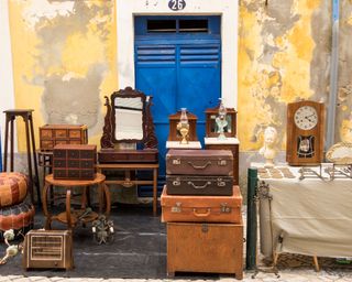 second-hand furniture outside a blue door