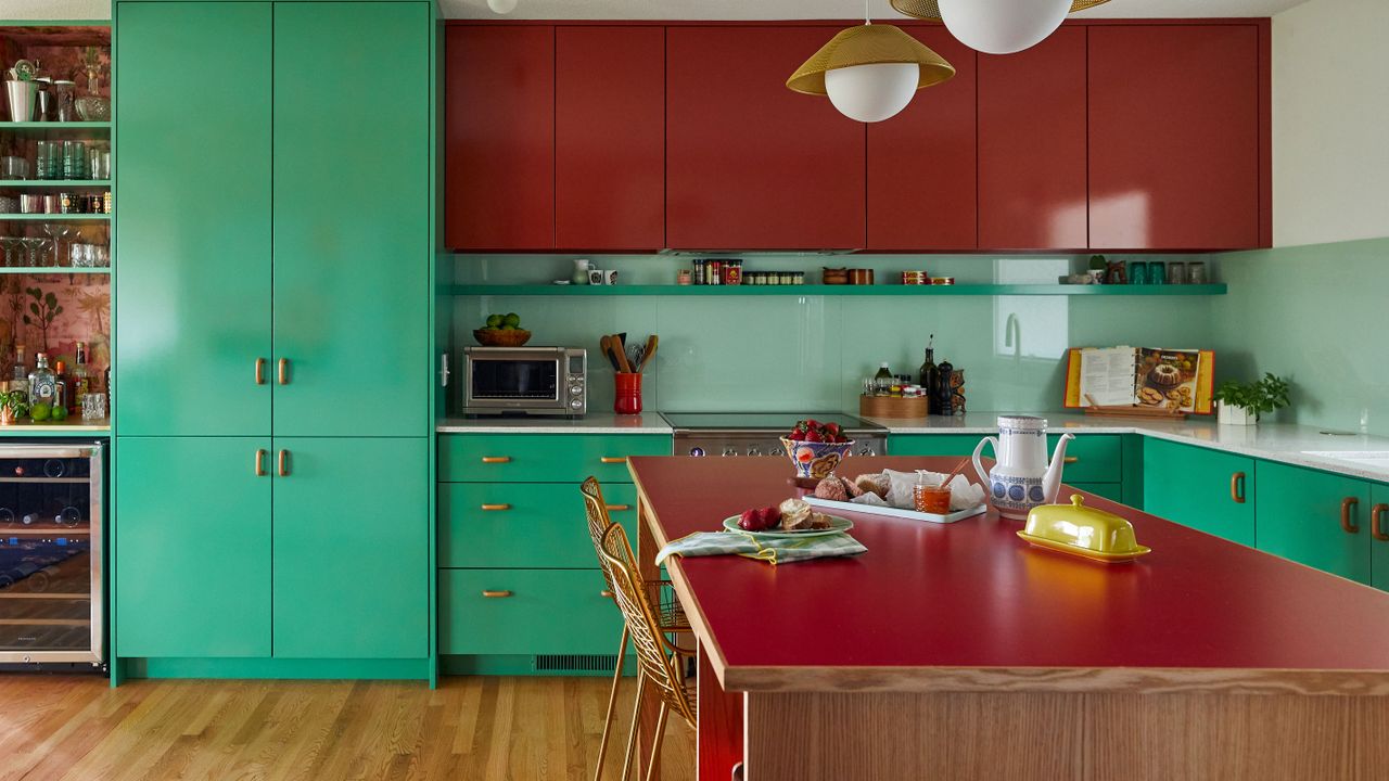 kitchen with green base units and red wall cabinets