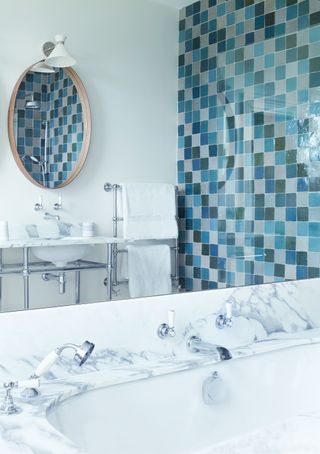 Blue and white bathroom with a tiled show enclosure